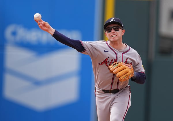 Braves shortstop Nick Allen puts his all into a throw to first base during Wednesday's game against the Rockies.