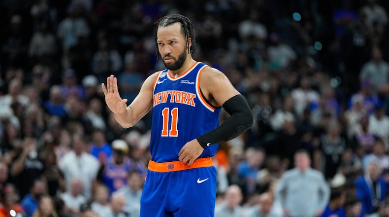 New York Knicks guard Jalen Brunson motions to teammates during the second half of Game 5 of the NBA Finals basketball series against the San Antonio Spurs, Saturday, June 13, 2026, in San Antonio. (AP Photo/Ross D. Franklin)