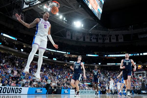 Florida guard Alijah Martin celebrates after scoring against UConn during the second half in the second round of the NCAA college basketball tournament, Sunday, March 23, 2025, in Raleigh, N.C. (AP Photo/Chris Carlson)