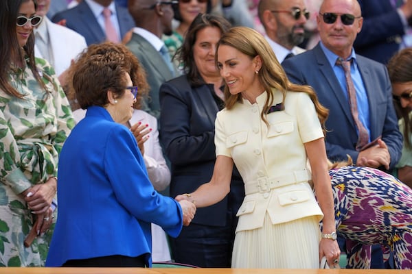 Britain's Kate, Princess of Wales shakes hands with tennis legend Billie Jean King in the Royal Box on Centre Court ahead of the women's singles final at the Wimbledon Tennis Championships in London, Saturday, July 12, 2025. (AP Photo/Kin Cheung)