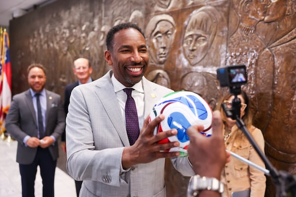 Mayor Andre Dickens is filmed with a soccer ball following a news conference at City Hall in Atlanta on Tuesday. (Arvin Temkar/AJC)