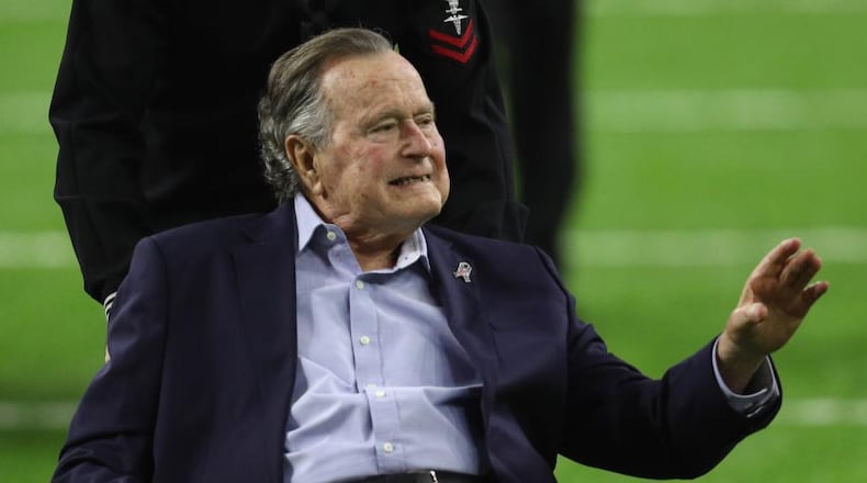 President George H.W. Bush arrives for the coin toss prior to Super Bowl 51 between the Atlanta Falcons and the New England Patriots at NRG Stadium on February 5, 2017 in Houston, Texas.  (Photo by Patrick Smith/Getty Images)