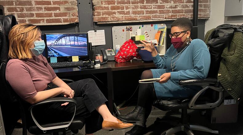 Amanda Washington (right), National New Play Network producer at Actor’s Express, meets with the company’s finance director, Marysa Sutton, to discuss a growing list of community engagement projects.
