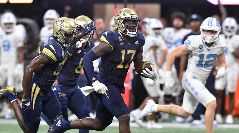 September 25, 2021 Atlanta - Georgia Tech's linebacker Demetrius Knight II (17) runs after recovering a fumble by North Carolina's quarterback Sam Howell (7) during the first half of an NCAA college football game at Mercedes-Benz Stadium in Atlanta on Saturday, September 25, 2021. (Hyosub Shin / Hyosub.Shin@ajc.com)