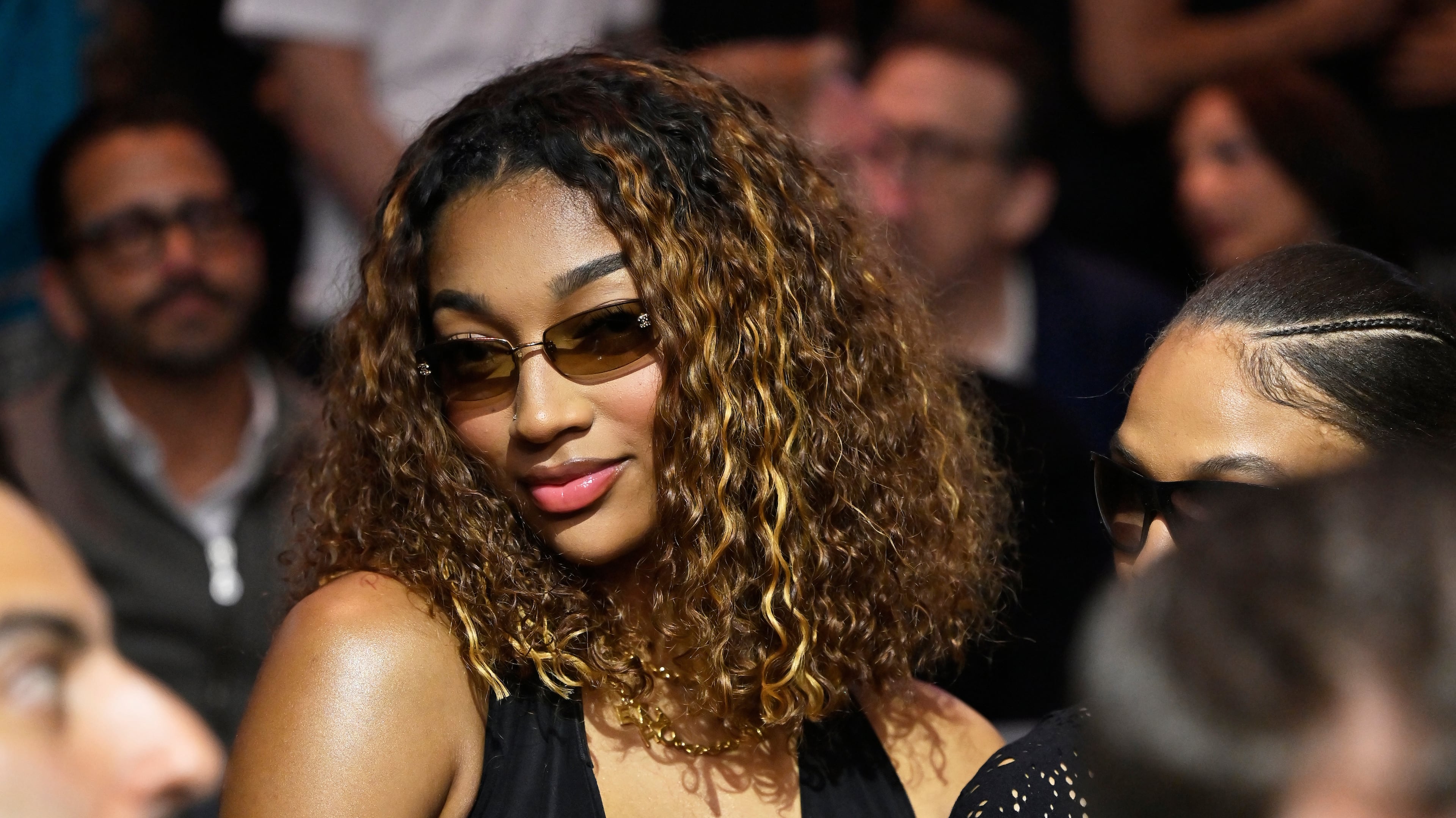 WNBA basketbal player Angel Reese sits at ringside during a super welterweight boxing match between Callum Walsh and Fernando Vargas Jr. in Las Vegas, Saturday, Sept. 13, 2025. (AP Photo/David Becker)