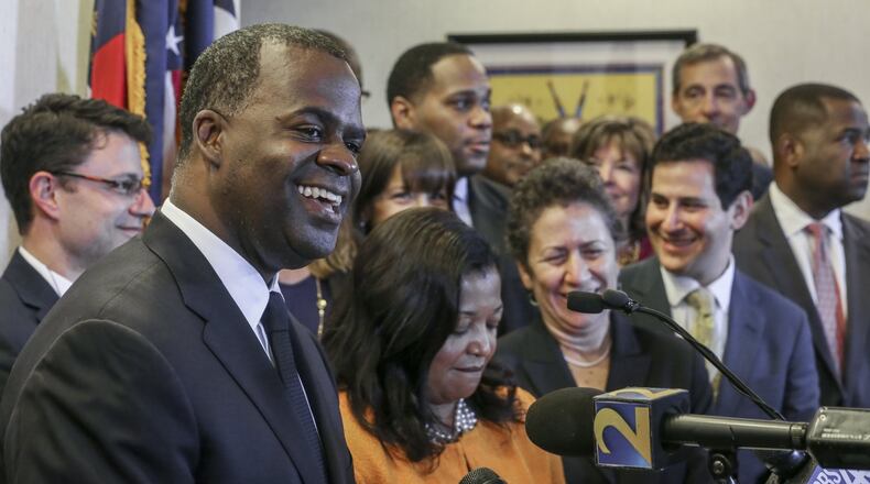 Mayor Kasim Reed with his legal team on Monday. JOHN SPINK /JSPINK@AJC.COM