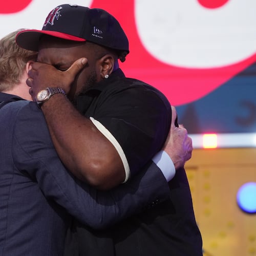 Ohio State defensive lineman Kayden McDonald, right, reacts with NFL Commissioner Roger Goodell after being chosen by the Houston Texans with the 36th overall pick during the second round of the NFL football draft, Friday, April 24, 2026, in Pittsburgh. (AP Photo/Gene J. Puskar)