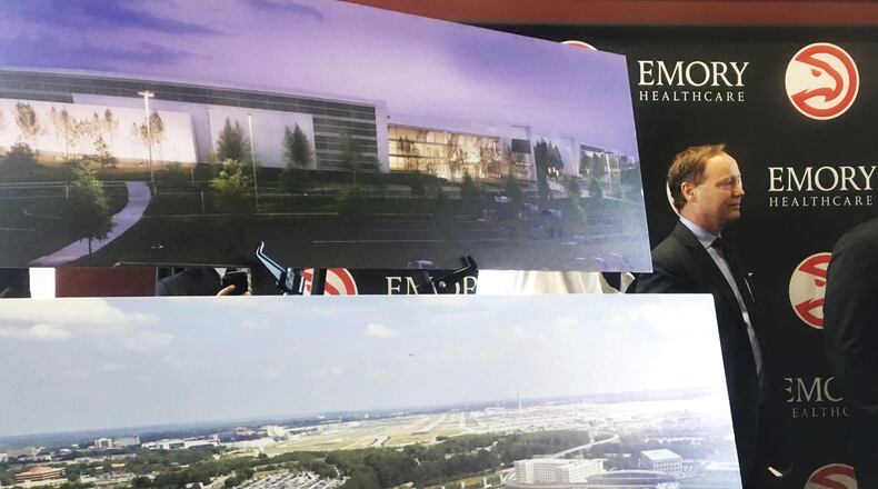 Atlanta Hawks coach Mike Budenholzer with renderings of a new 3,500-seat arena that will host Atlanta’s new NBA Development League, or D-League, team beginning in 2019. (Paul Newberry / Associated Press)