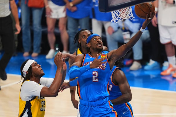 Oklahoma City Thunder guard Shai Gilgeous-Alexander (2) shoots against Indiana Pacers center Myles Turner (33) during the first half of Game 7 of the NBA Finals basketball series Sunday, June 22, 2025, in Oklahoma City. (AP Photo/Kyle Phillips)