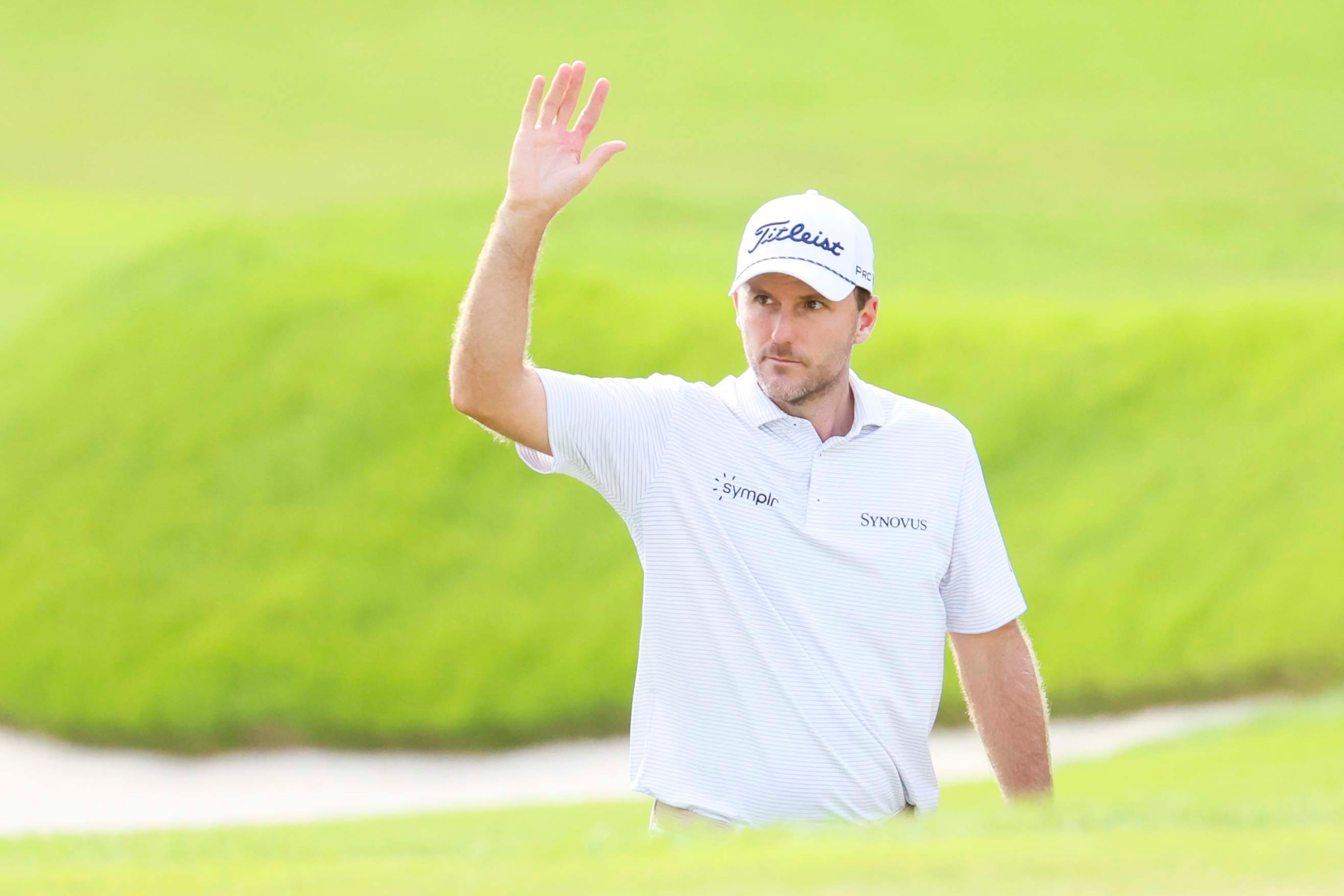 Russell Henley waves to the fans as he is recognized at the 18th hole during the final round of the PGA Tour Championship at East Lake Golf Club, on Sunday, Aug. 24, 2025, in Atlanta. (Miguel Martinez/ AJC)