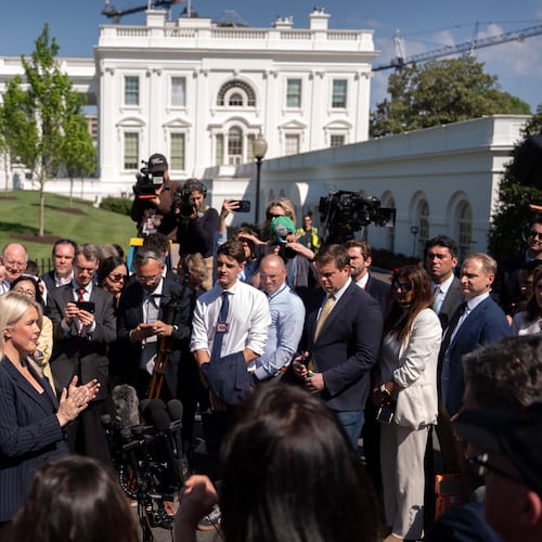 White House press secretary Karoline Leavitt speaks with reporters outside the White House, Wednesday, April 22, 2026, in Washington. (AP Photo/Mark Schiefelbein)