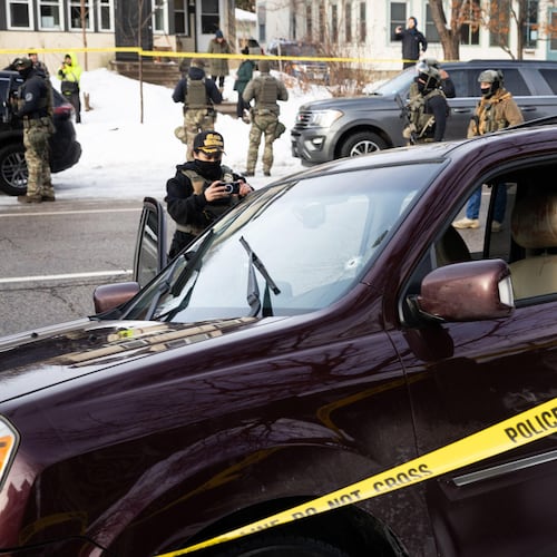 A bullet hole and blood stains are seen in a crashed vehicle on at the scene of a shooting in Minneapolis on Wednesday, Jan. 7, 2026. (Ben Hovland/Minnesota Public Radio via AP)