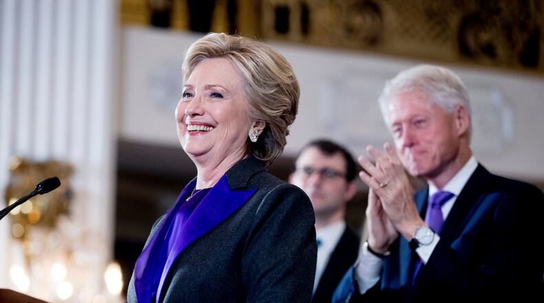 Hillary Clinton, accompanied by former President Bill Clinton, right, pauses while speaking to staff and supporters at the New Yorker Hotel in New York, Wednesday, Nov. 9, 2016, where she conceded her defeat to Republican Donald Trump after the hard-fought presidential election. (AP Photo/Andrew Harnik)