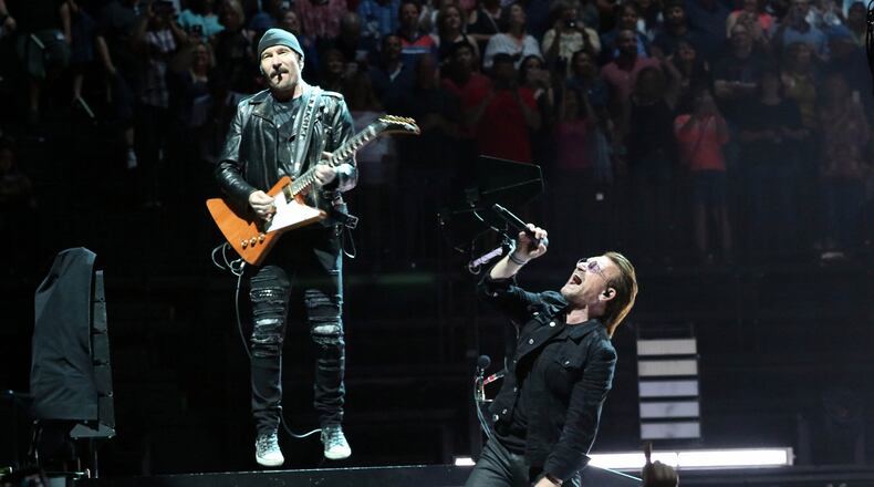 The Edge and Bono share a moment during the band's May 28, 2018 show at Infinite Energy Arena - U2's first Atlanta appearance in almost a decade. Photo: Robb Cohen Photography & Video /RobbsPhotos.com