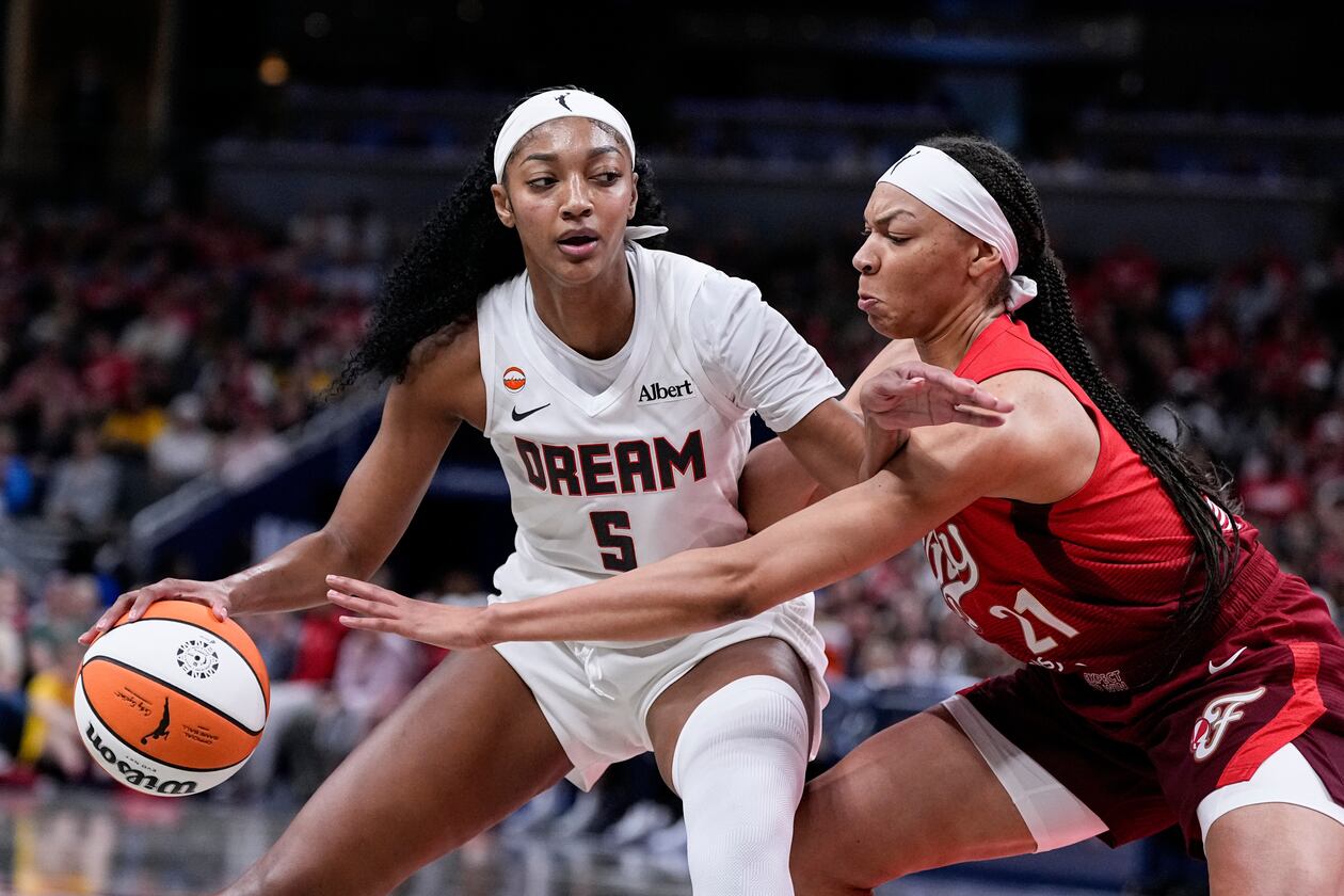 Atlanta Dream forward Angel Reese (5) works around Indiana Fever forward Makayla Timpson (21) in the second half of a WNBA basketball game in Indianapolis, Thursday, June 18, 2026. Reese led the Dream with 21 points and added 11 rebounds on Thursday night. (Michael Conroy/AP)