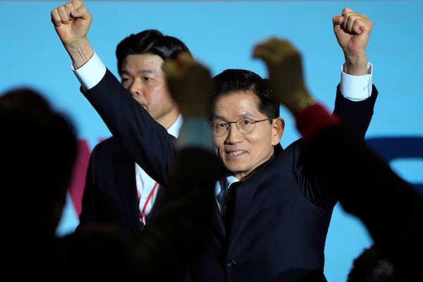 South Korea's former Labor Minister Kim Moon Soo is greeted by supporters as he arrives to attend the People Power Party's convention in Goyang, South Korea, Saturday, May 3, 2025. (AP Photo/Ahn Young-joon)