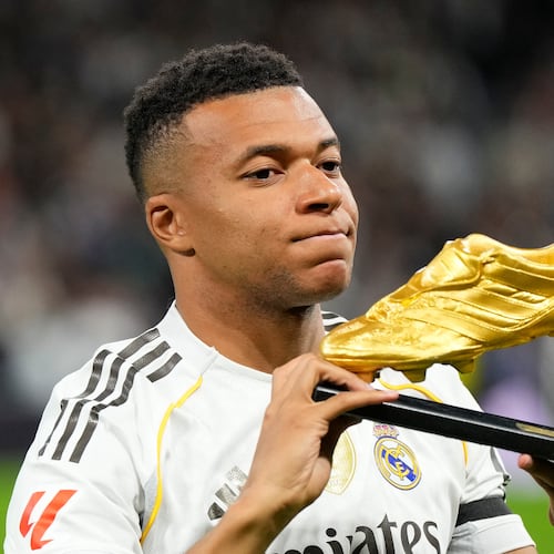 Real Madrid's Kylian Mbappe poses with the Golden Boot award before the Spanish La Liga soccer match between Real Madrid and Valencia in Madrid, Spain, Saturday, Nov. 1, 2025. (AP Photo/Manu Fernandez)