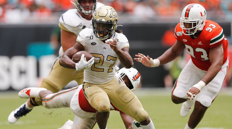 MIAMI, FLORIDA - OCTOBER 19:  Jordan Mason #27 of the Georgia Tech Yellow Jackets runs with the ball against the Miami Hurricanes during the second half at Hard Rock Stadium on October 19, 2019 in Miami, Florida. (Photo by Michael Reaves/Getty Images)