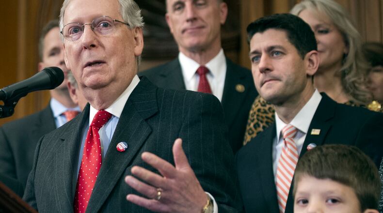 House Speaker Paul Ryan of Wis., and others, listen as Senate Majority Leader Mitch McConnell of Ky., speaks on Capitol Hill last month. (AP Photo/Cliff Owen, File)