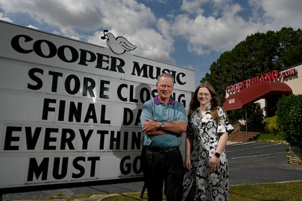 Blake Cooper and Laura Cooper are preparing for the store to close. (Hyosub Shin/AJC)