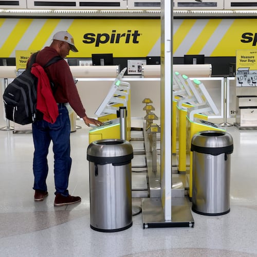 Pierre Ronet tries to check in to his flight to Tampa on Spirit Airlines at Fort Lauderdale-Hollywood International Airport, only to find out it was cancelled on Saturday, May 2, 2026. (Mike Stocker /South Florida Sun-Sentinel via AP)