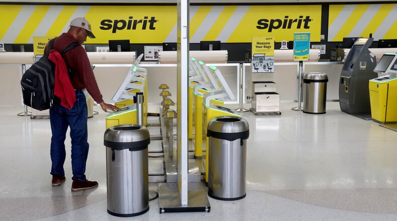 Pierre Ronet tries to check in to his flight to Tampa on Spirit Airlines at Fort Lauderdale-Hollywood International Airport, only to find out it was cancelled on Saturday, May 2, 2026. (Mike Stocker /South Florida Sun-Sentinel via AP)