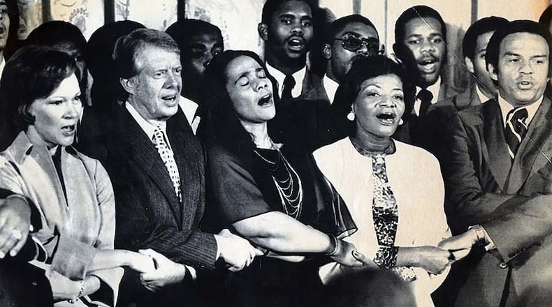 First Lady Rosalynn Carter, (left to right) President Jimmy Carter, Coretta Scott King, Christine King Farris, the sister of the Rev. Martin Luther King, and U.N. Ambassador Andrew Young all sing during a reception held at the White House to honor the organization Friends of Martin Luther King Jr. Center for Social Change.
Credit: Associated Press