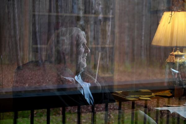 Allen Levi sits inside his writing shed in Hamilton, where he prefers to write without access to his phone or the internet. (Hyosub Shin/AJC)