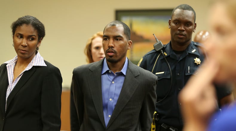 Alleged serial killer Aeman Presley leaves DeKalb court after pleading not guilty Wednesday afternoon May 27, 2015 to charges stemming from the shooting death of a hairdresser on the downtown Decatur square. Ben Gray / bgray@ajc.com