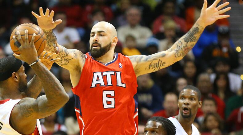 012014 ATLANTA: Hawks center Pero Antic defends against Heat forward LeBron James forcing him to pass it off during the first half of their NBA basketball game on Monday, Jan. 20, 2014, in Atlanta. CURTIS COMPTON / CCOMPTON@AJC.COM