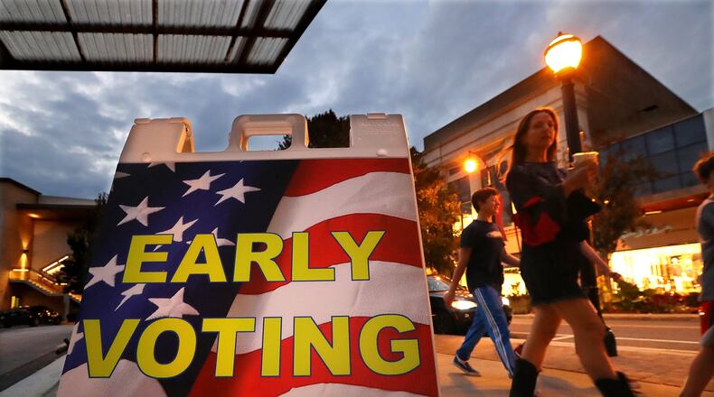 An early voting sign sits in front of the Buckhead Library in Atlanta. Early voting will not happen at the library until a broken sewer is fixed. Curtis Compton/ccompton@ajc.com AJC FILE PHOTO