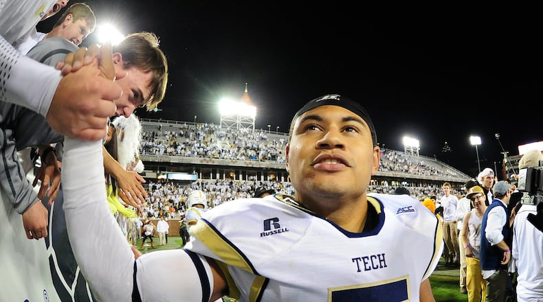 ATLANTA, GA - OCTOBER 4: Justin Thomas #5 of the Georgia Tech Yellow Jackets celebrates with fans after the game against the Miami Hurricanes at Bobby Dodd Stadium on October 4, 2014 in Atlanta, Georgia. (Photo by Scott Cunningham/Getty Images)