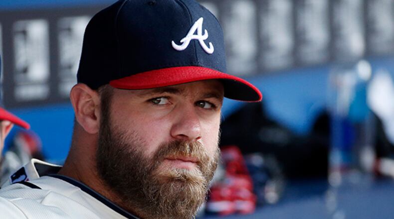 Atlanta Braves catcher Evan Gattis has been on the bench since June 27 with a bulging disc in his upper back.