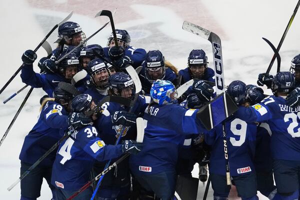 Finland's players celebrate after winning the bronze medal match between Czech Republic and Finland at the Women's Ice Hockey Championships in Ceske Budejovice, Czech Republic, Sunday, April 20, 2025. (AP Photo/Petr David Josek)