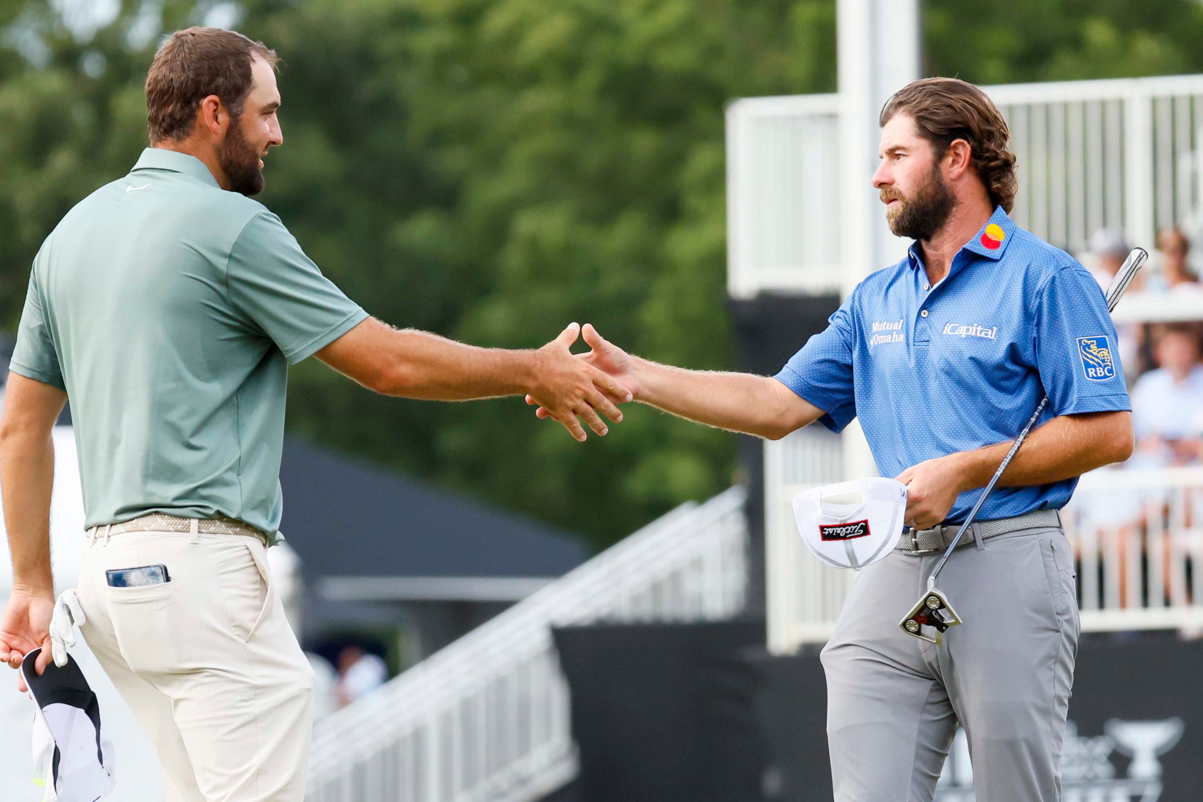 Cameron Young and Scottie Scheffler shake hands after finishing their final round of the PGA Tour Championship at East Lake Golf Club on Sunday, Aug. 24, 2025, in Atlanta. (Miguel Martinez/ AJC)