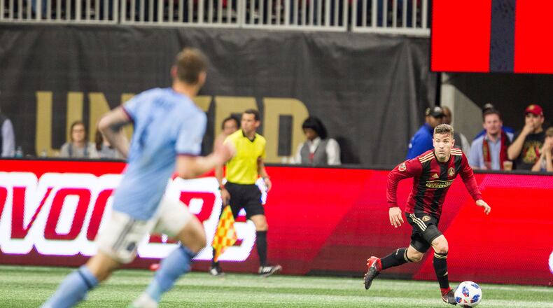 Atlanta United defender Greg Garza (4) runs with the ball down the field during the match between NYC FC and Atlanta United at Mercedes-Benz Stadium in Atlanta, Georgia, on Sunday, April 15, 2018. (REANN HUBER/REANN.HUBER@AJC.COM)