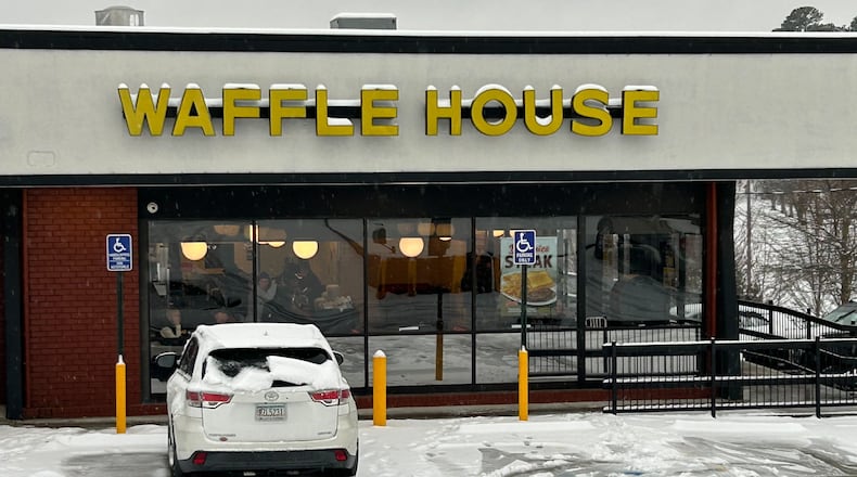 Patrons dine inside a Waffle House on Chamblee Dunwoody Road in Dunwoody on Friday, January, 10, 2025. (J. Scott Trubey/AJC)