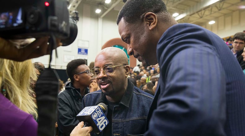 Actor Chris Tucker (right) and Rap mogul Jermaine Dupri (cener) answer questions from the media during a rally for gubernatorial candidate Stacey Abrams in Forbes Arena at Morehouse College, Friday, November 2, 2018. (ALYSSA POINTER/ALYSSA.POINTER@AJC.COM)