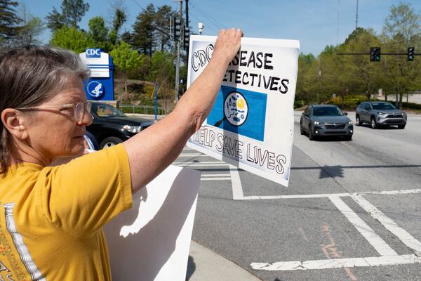 Chris Van Beneden, who worked at the Centers for Disease Control and Prevention for 25 years, protests in support of the CDC in front of its Atlanta headquarters on Tuesday, April 1, 2025 after layoffs were announced. (AP Photo/Ben Gray)