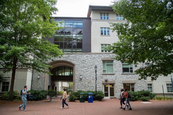 People walk past Longstreet-Means Hall on the Emory University campus in Atlanta, Tuesday, June 29, 2021. Emory University will change the name of the building to Eagle Hall. (Alyssa Pointer / Alyssa.Pointer@ajc.com)

