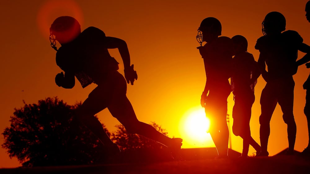 A file photo shows high school football players in Texas. 