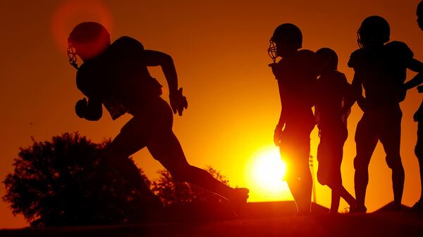 A file photo shows high school football players in Texas. 