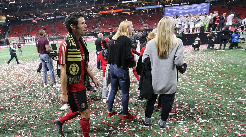 October 30, 2019 Atlanta: Atlanta United defender Michael Parkhurst, who is retiring, walks off the field after his final game while Toronto FC celebrates a 2-1 victory during the trophy presentation in the Eastern Conference Final on Wednesday, October 30, 2019, in Atlanta. Curtis Compton/ccompton@ajc.com