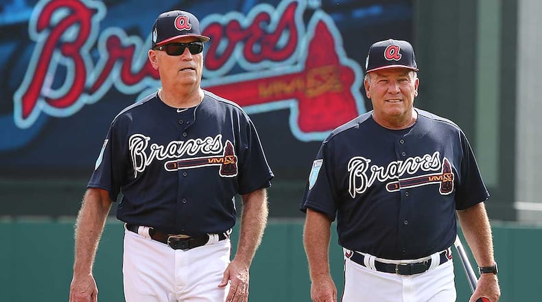Brian Snitker (left, with Dave Trembley during spring training) is beginning his second full season as the manager of the Braves. (Curtis Compton/ccompton@ajc.com)