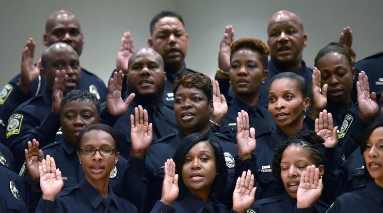 Atlanta Public Schools swore in members of a new district police force in June. HYOSUB SHIN / HSHIN@AJC.COM
