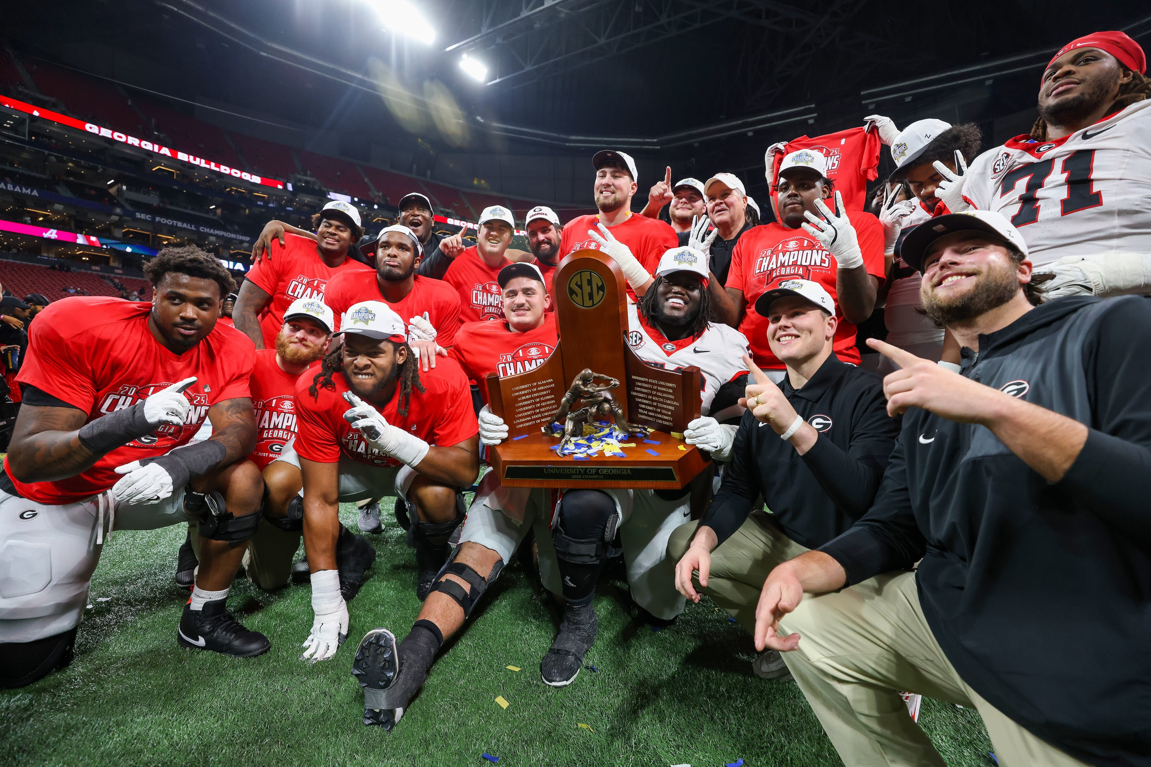 Georgia celebrates a 28-7 victory over Alabama in the SEC Championship game at Mercedes-Benz Stadium, Saturday, Dec. 6, 2025, in Atlanta. (Jason Getz / AJC)