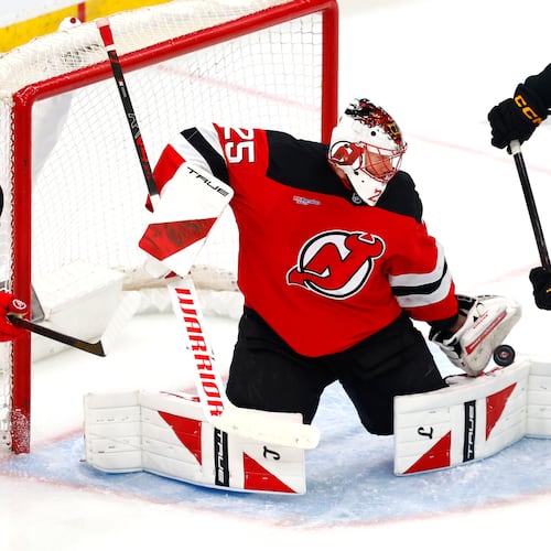 FILE - New Jersey Devils goaltender Jacob Markstrom (25) makes a save against Boston Bruins forward Alex Steeves (21) during the third period of an NHL hockey game, March 16, 2026, in Newark, N.J. (AP Photo/Noah K. Murray, File)