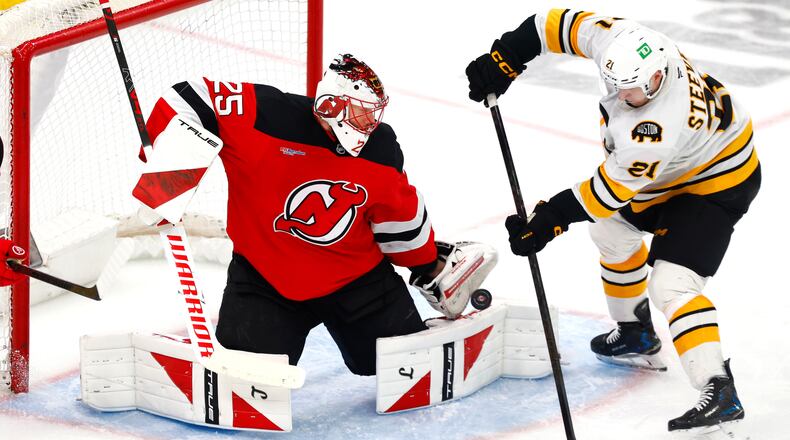 FILE - New Jersey Devils goaltender Jacob Markstrom (25) makes a save against Boston Bruins forward Alex Steeves (21) during the third period of an NHL hockey game, March 16, 2026, in Newark, N.J. (AP Photo/Noah K. Murray, File)