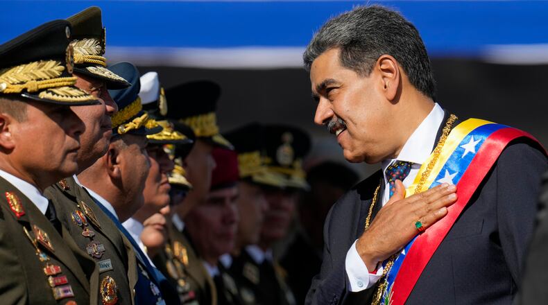 FILE - Venezuela's President Nicolas Maduro places his hand over his hear while talking to high-ranking officers during a military ceremony on his inauguration day for a third term, in Caracas, Venezuela, Jan. 10, 2025. (AP Photo/Ariana Cubillos, File)