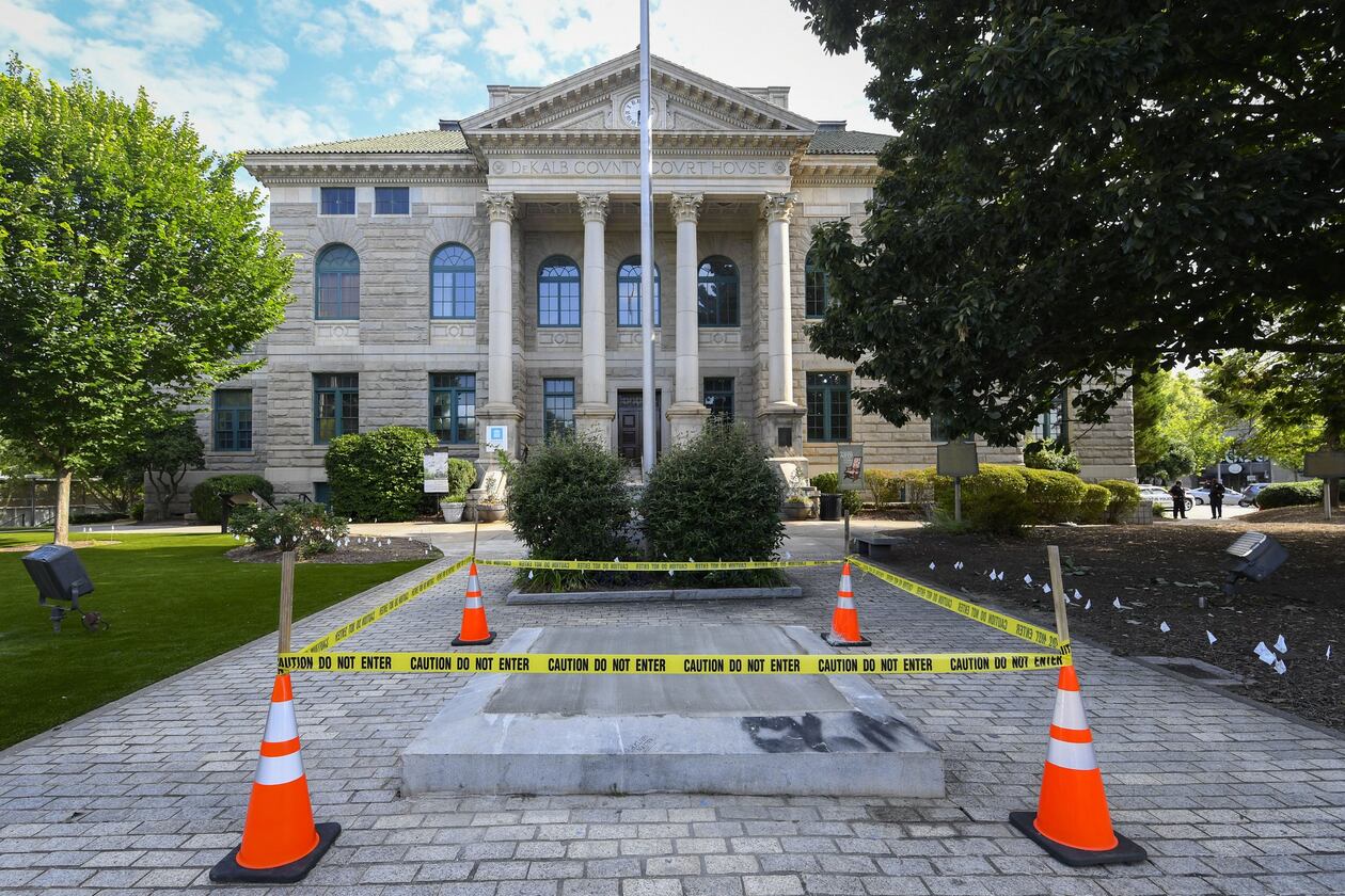 The spot where an obelisk confederate monument once stodd on the courthouse grounds, is shown before a press conference occurs in reference to it in Decatur. DeKalb Superior Court Judge Clarence Seeliger declared the monument that was erected in 1908 by the United Daughters of the Confederacy, to be a public nuisance that should be removed. JOHN AMIS FOR THE ATLANTA JOURNAL-CONSTITUTION AJC FILE PHOTO